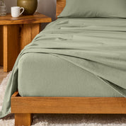 A modern bedroom with cotton flannel sheets on the bed