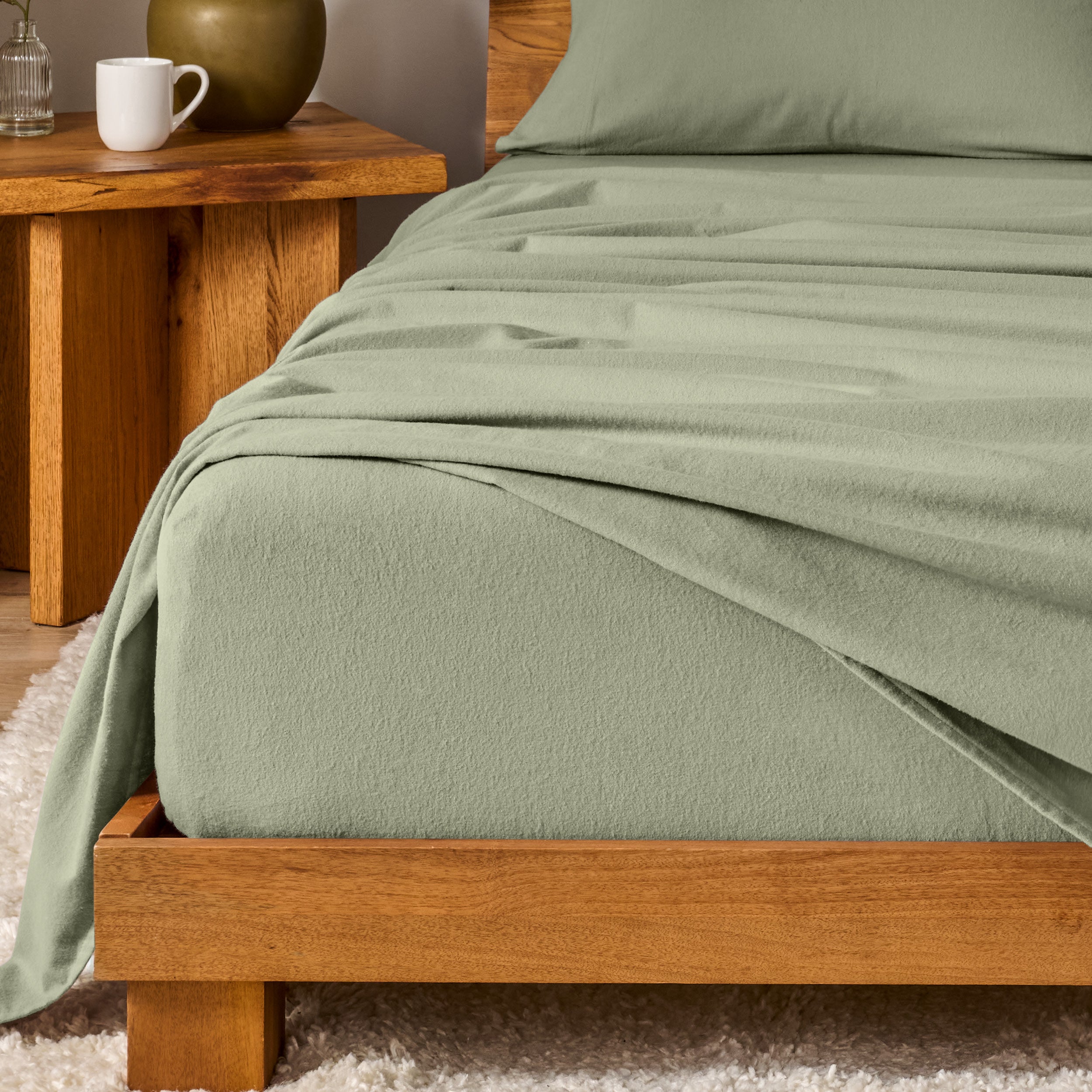 A modern bedroom with cotton flannel sheets on the bed