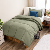 A modern bed with a down alternative comforter set on it