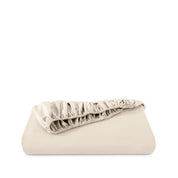 Fitted sheet neatly folded on a white background