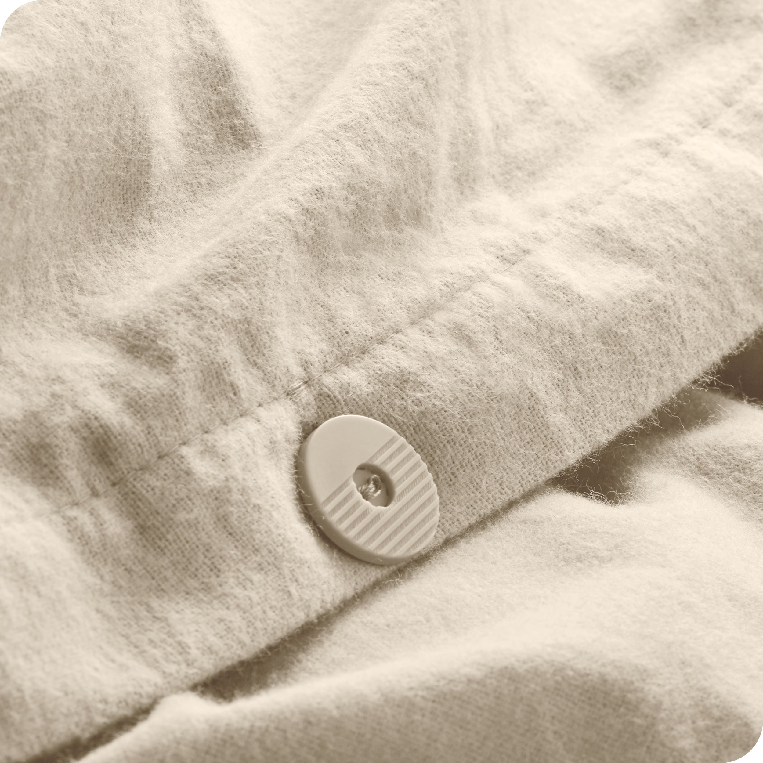 A close up of the tie corner of the duvet cover.