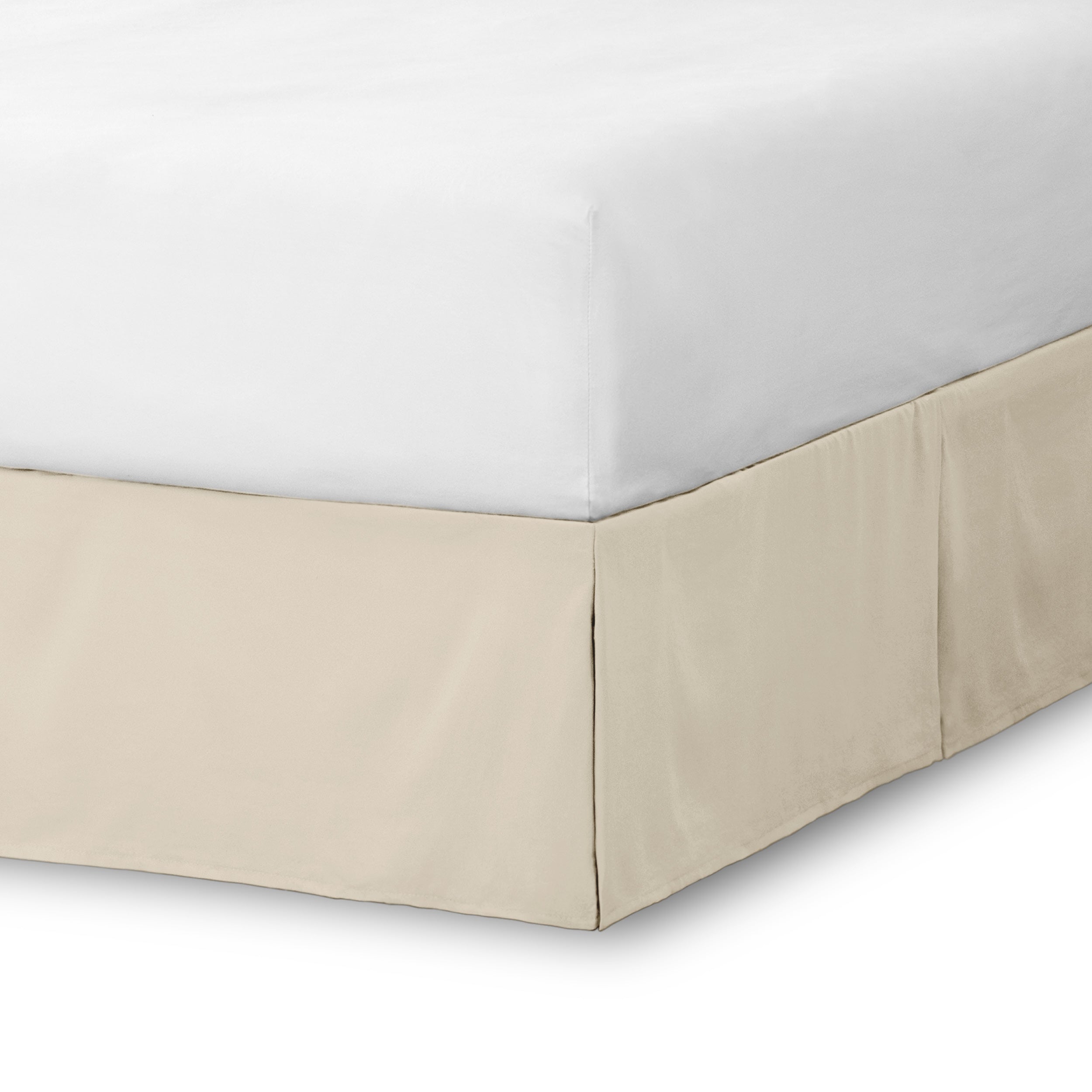 The corner of a bed skirt on a bed frame