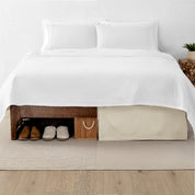 A split image showing a bed without a bed skirt on the left and with a bed skirt on the right.