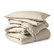 A microfiber comforter folded neatly with a pillow from above
