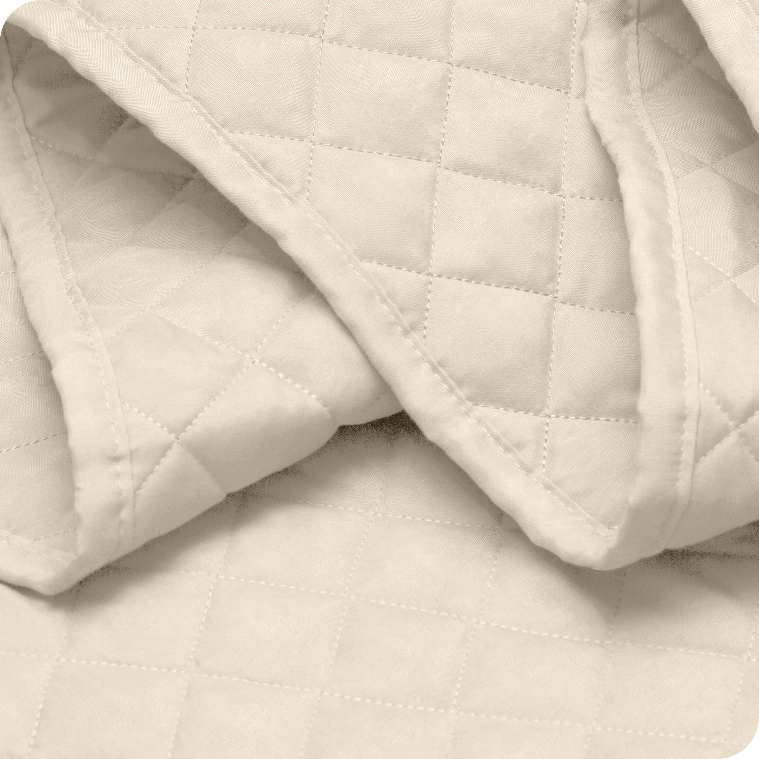 Close up of a coverlet showing the stitching
