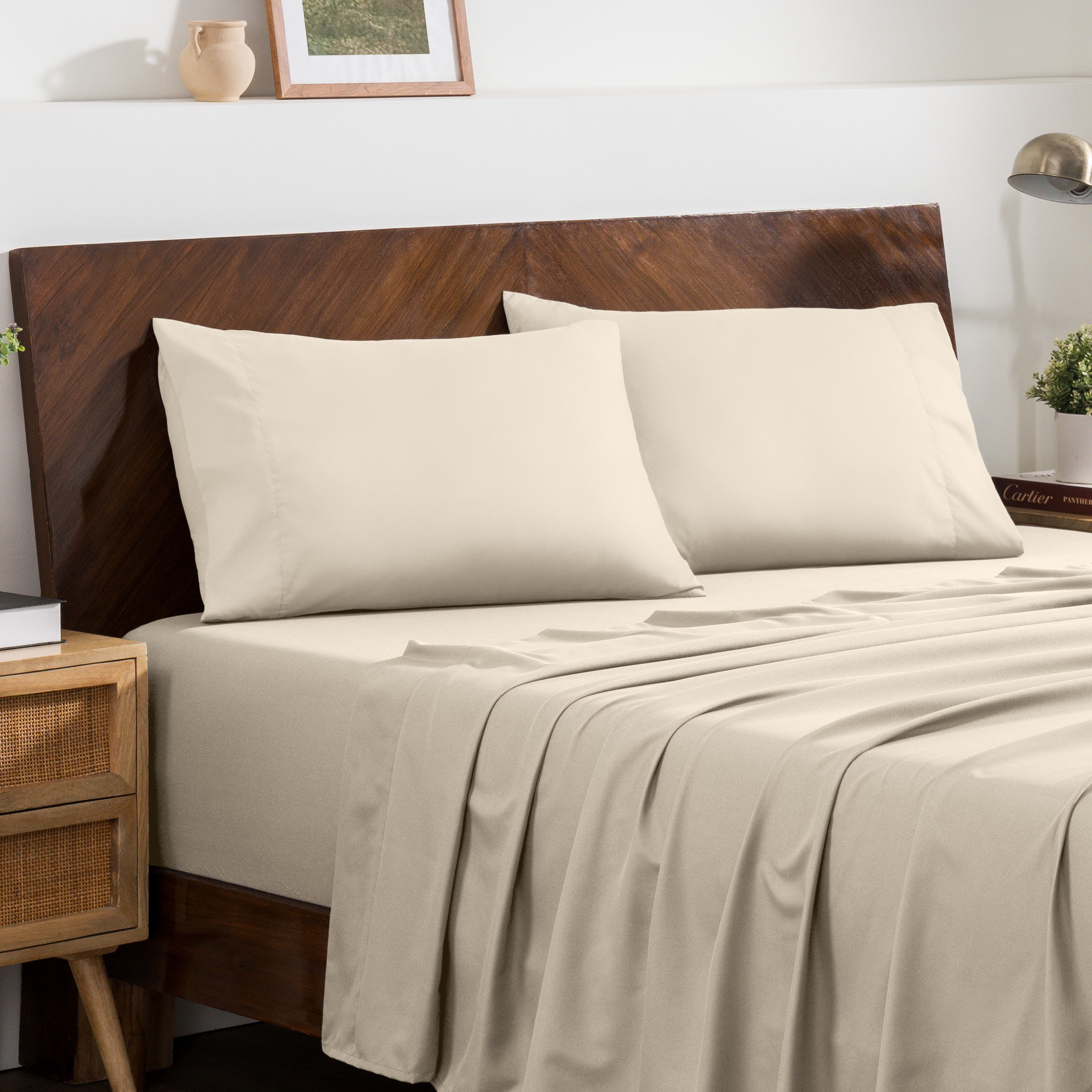 2 pillowcases on pillows on a nicely made bed