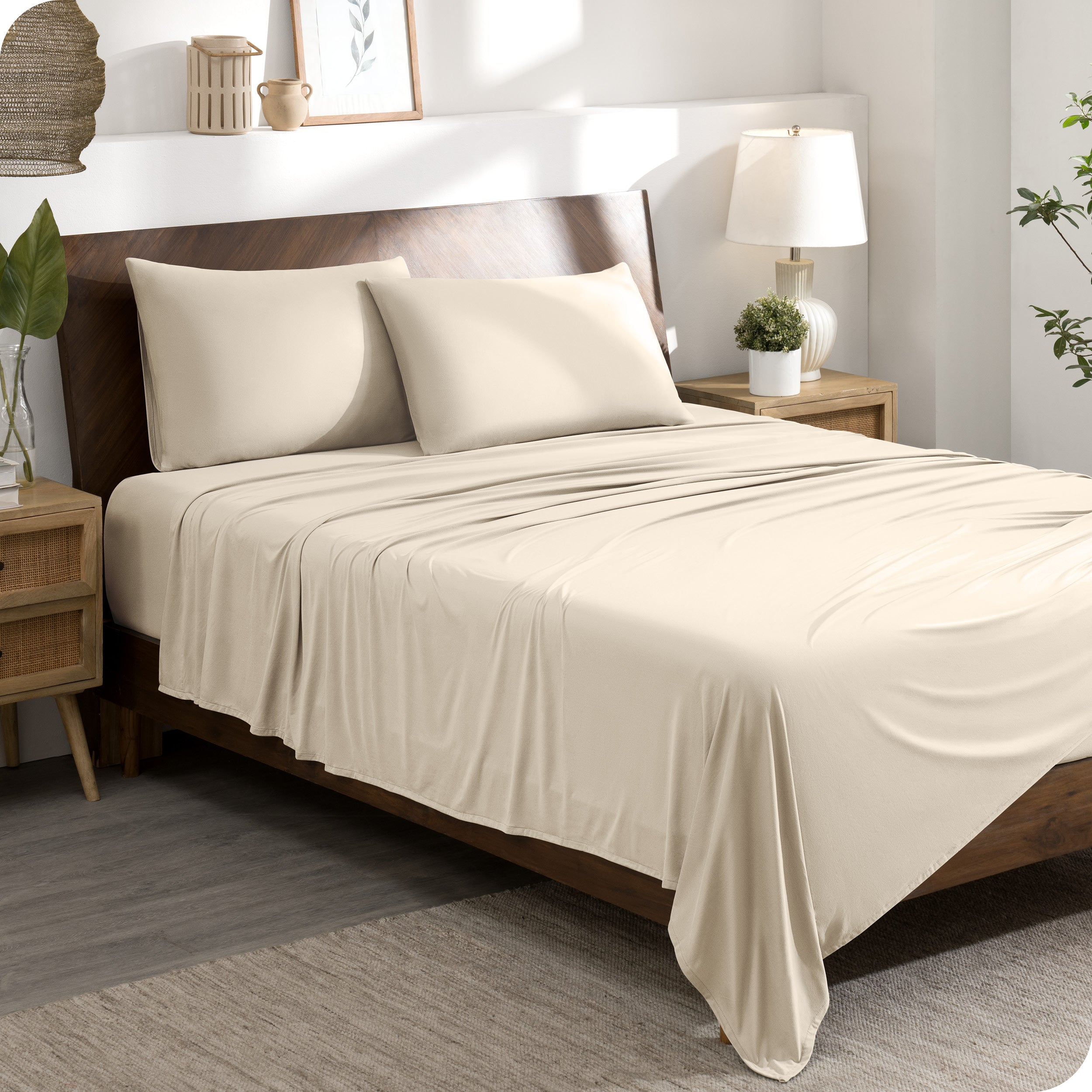 A stretch knit microfiber sheet set on a bed