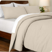 A side view of a bed made with a track stitch comforter set
