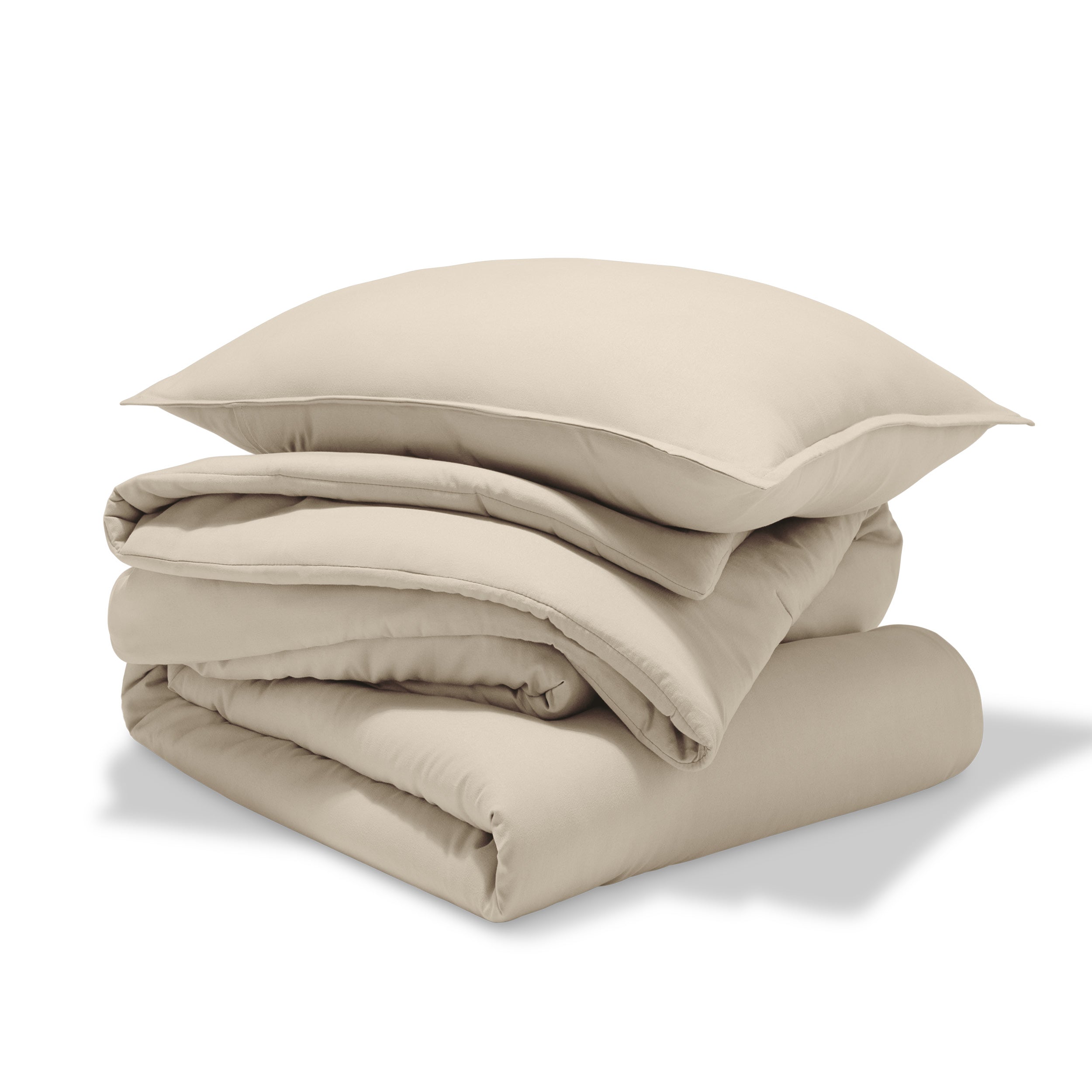 A comforter folded with a matching pillow sham stacked on top