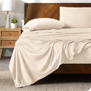 A sand sheet set on a bed with a wooden bed frame