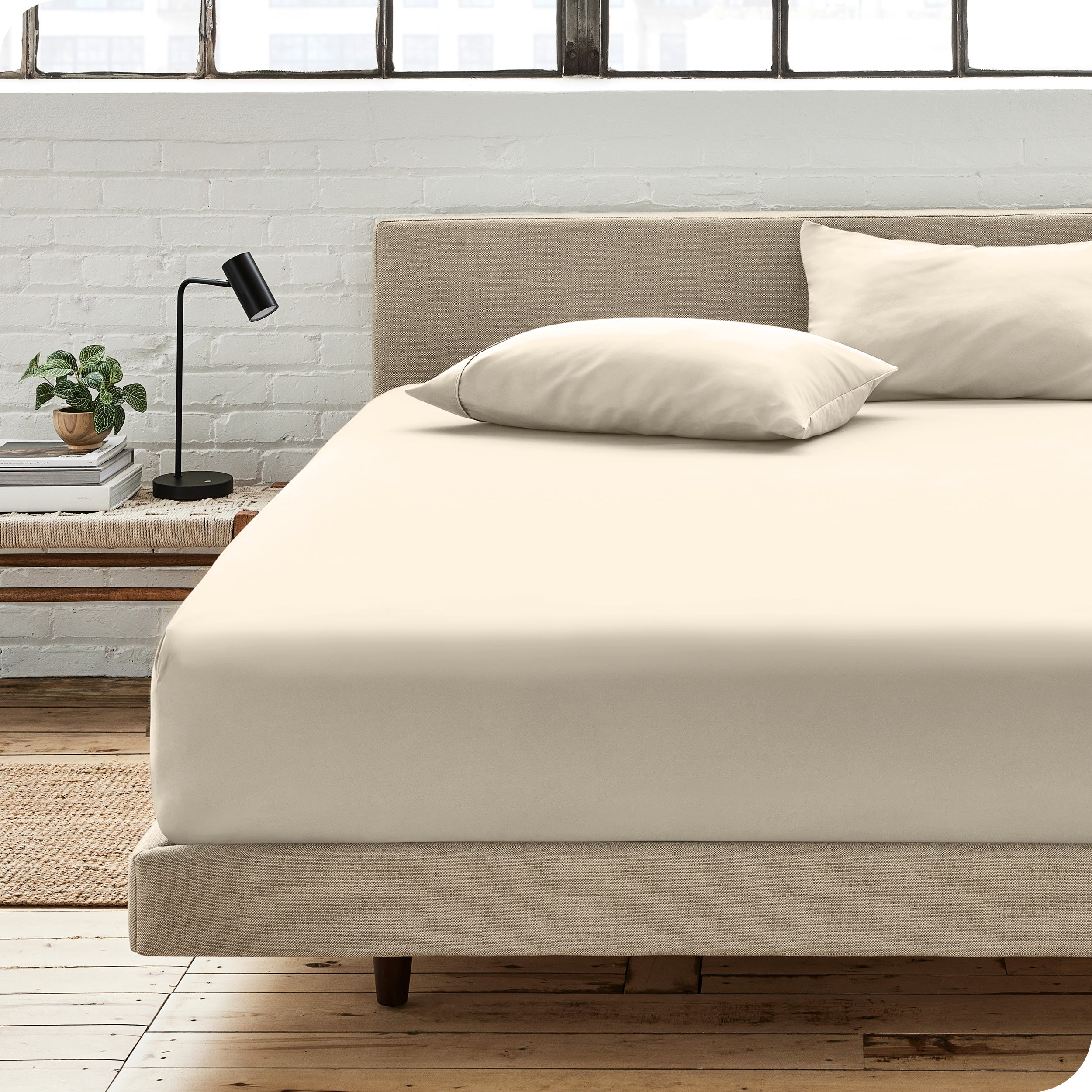 An organic cotton fitted sheet on a mattress