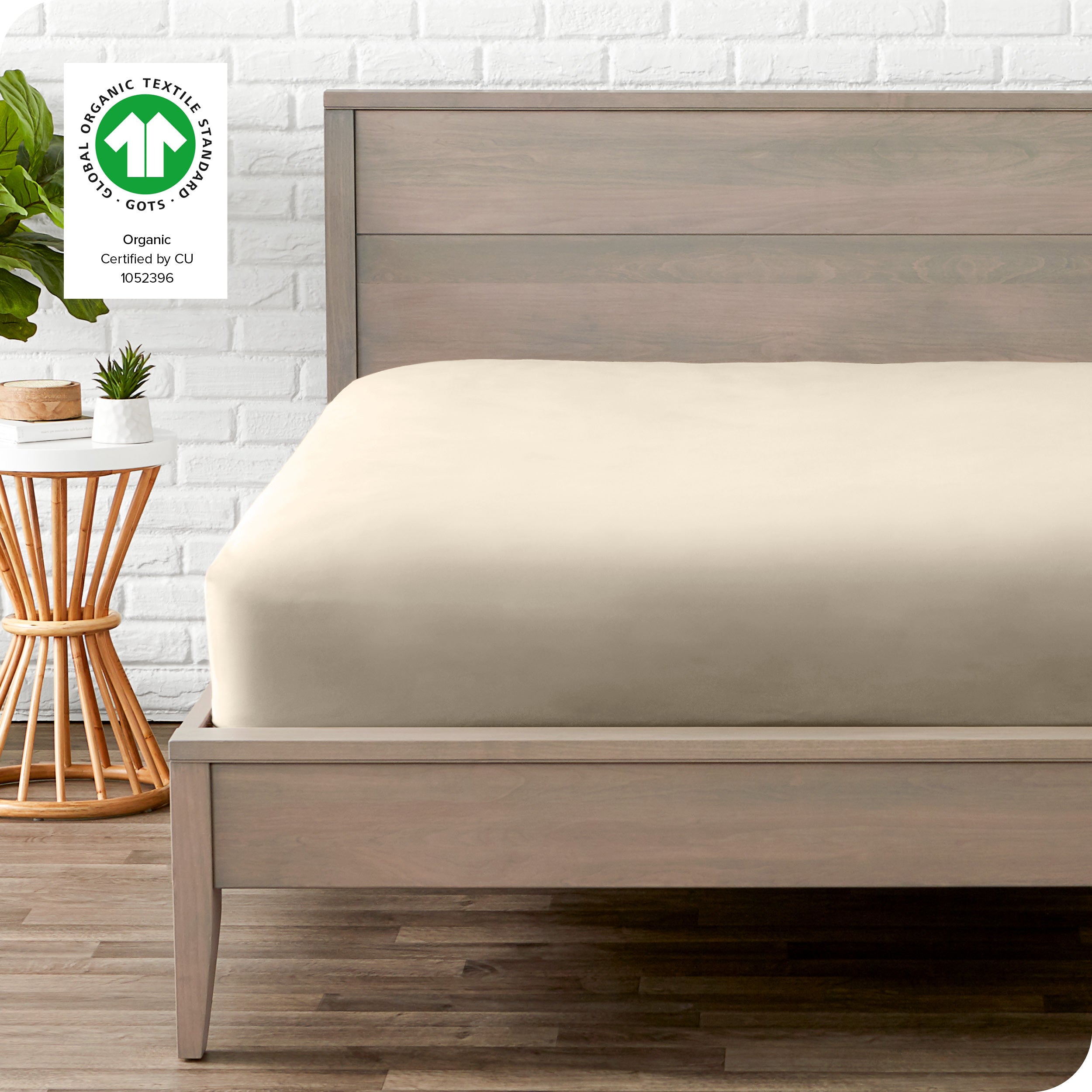 An organic percale bottom sheet on a mattress