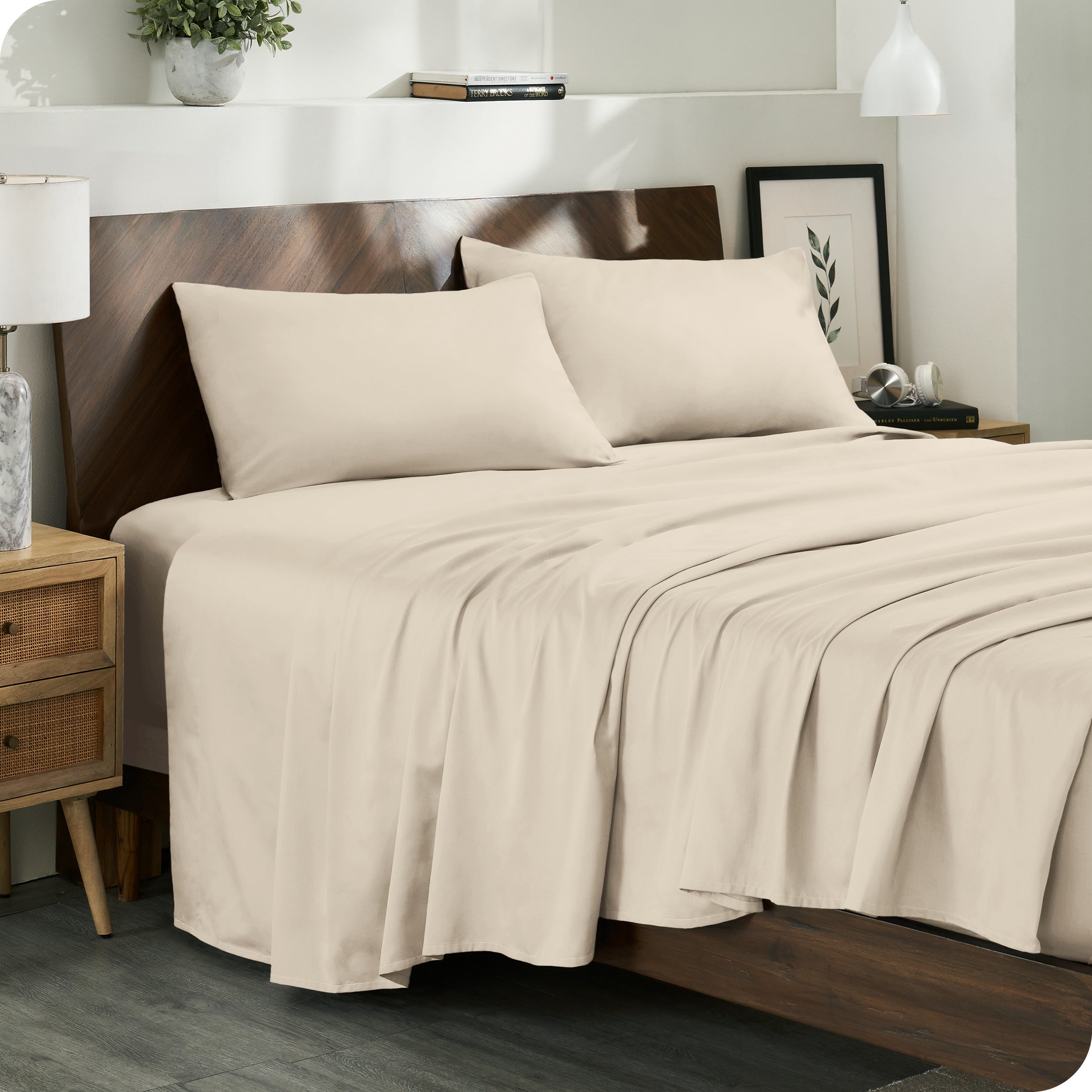 Diagonal view of a decorated room scene with sateen sheets