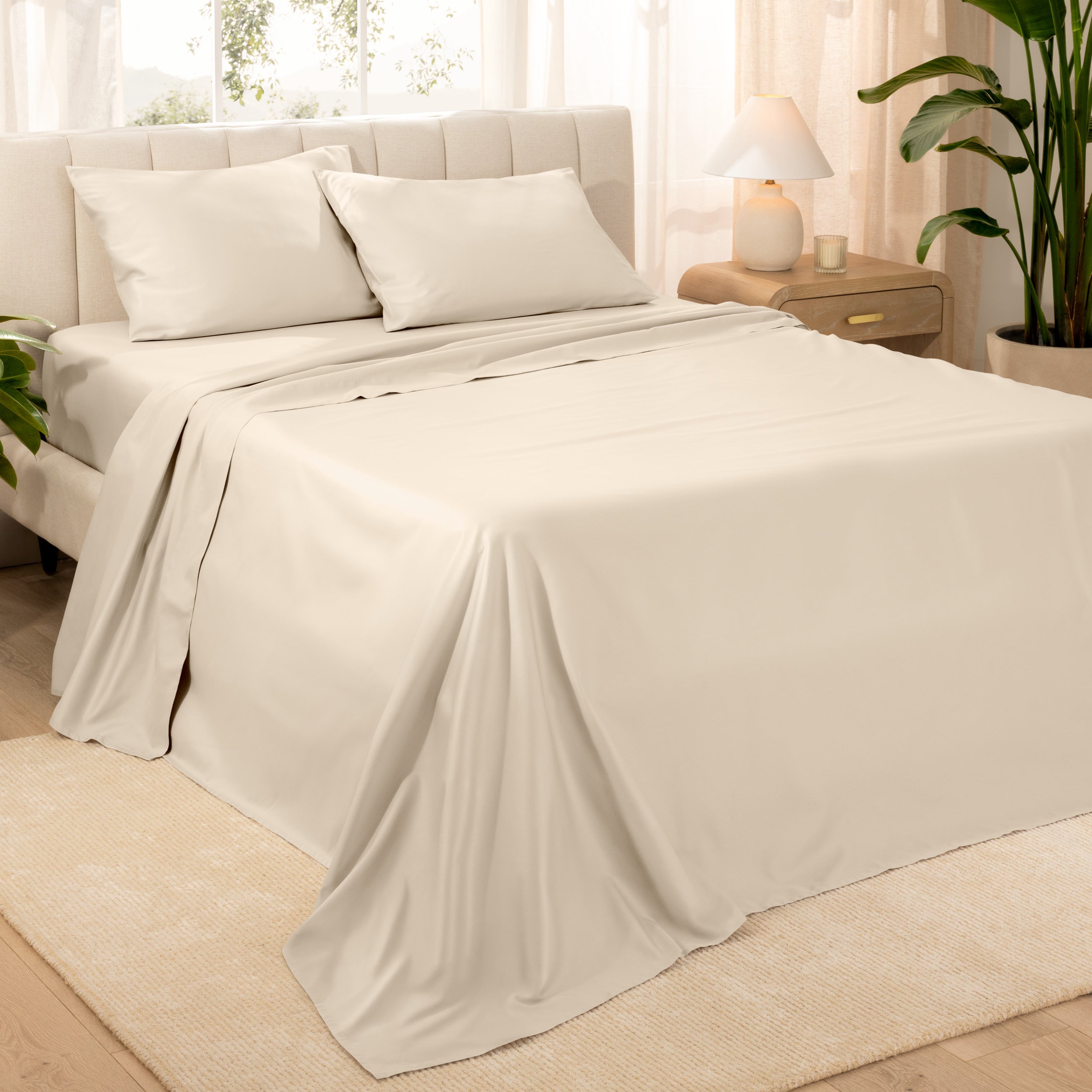 Diagonal view of a decorated room scene with sateen sheets