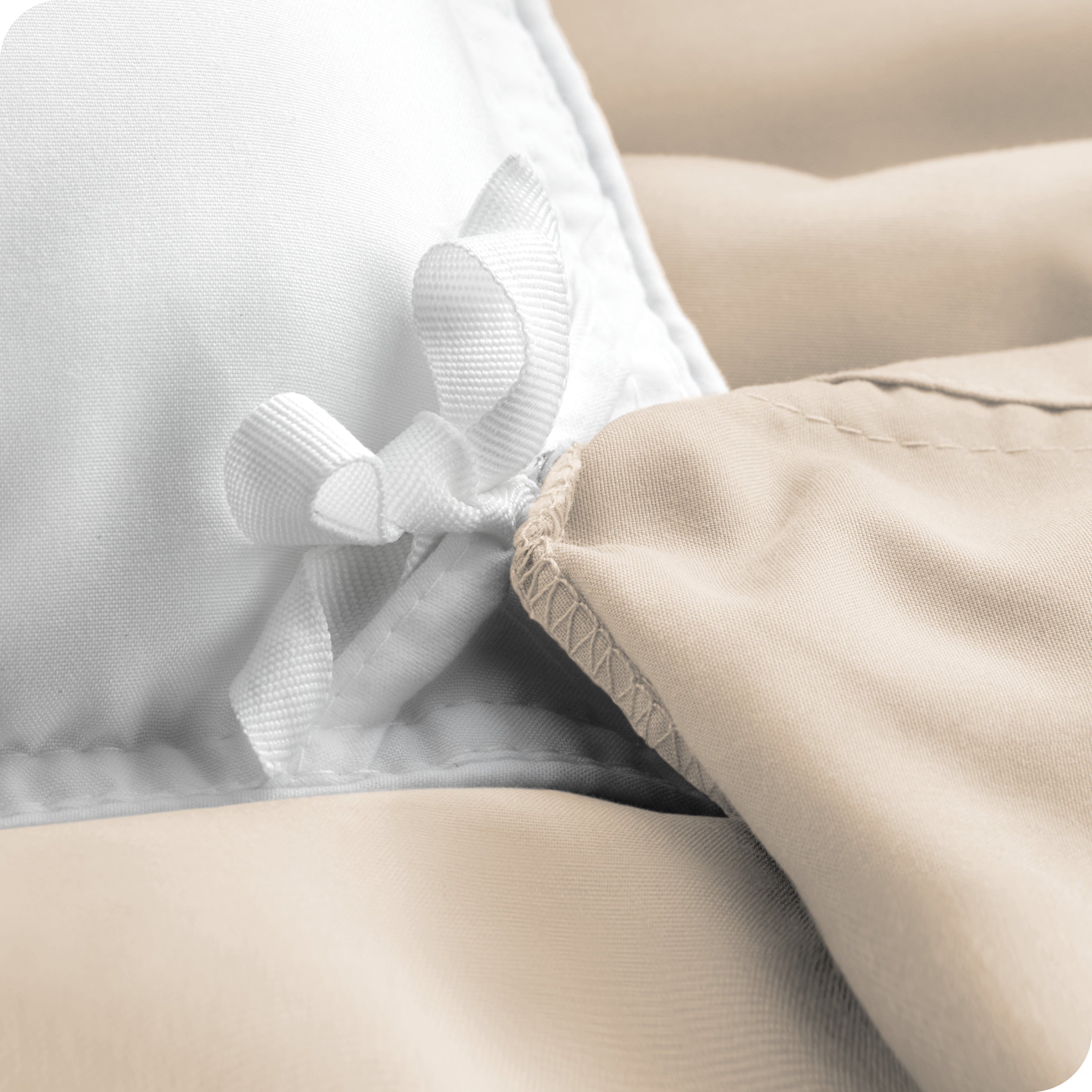The corner ties of a duvet cover attached to a duvet insert