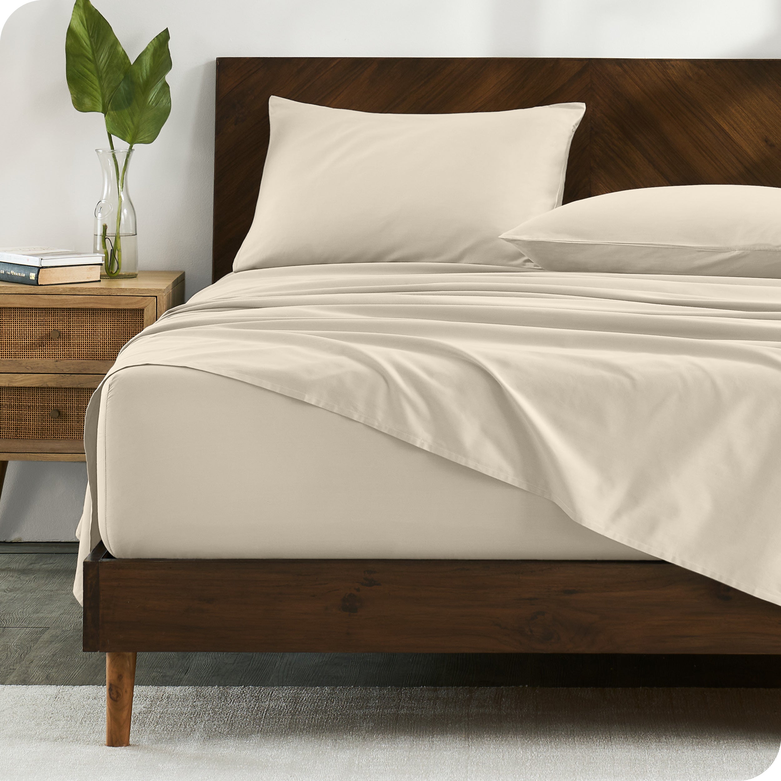 Percale sheets on bed in a modern bedroom