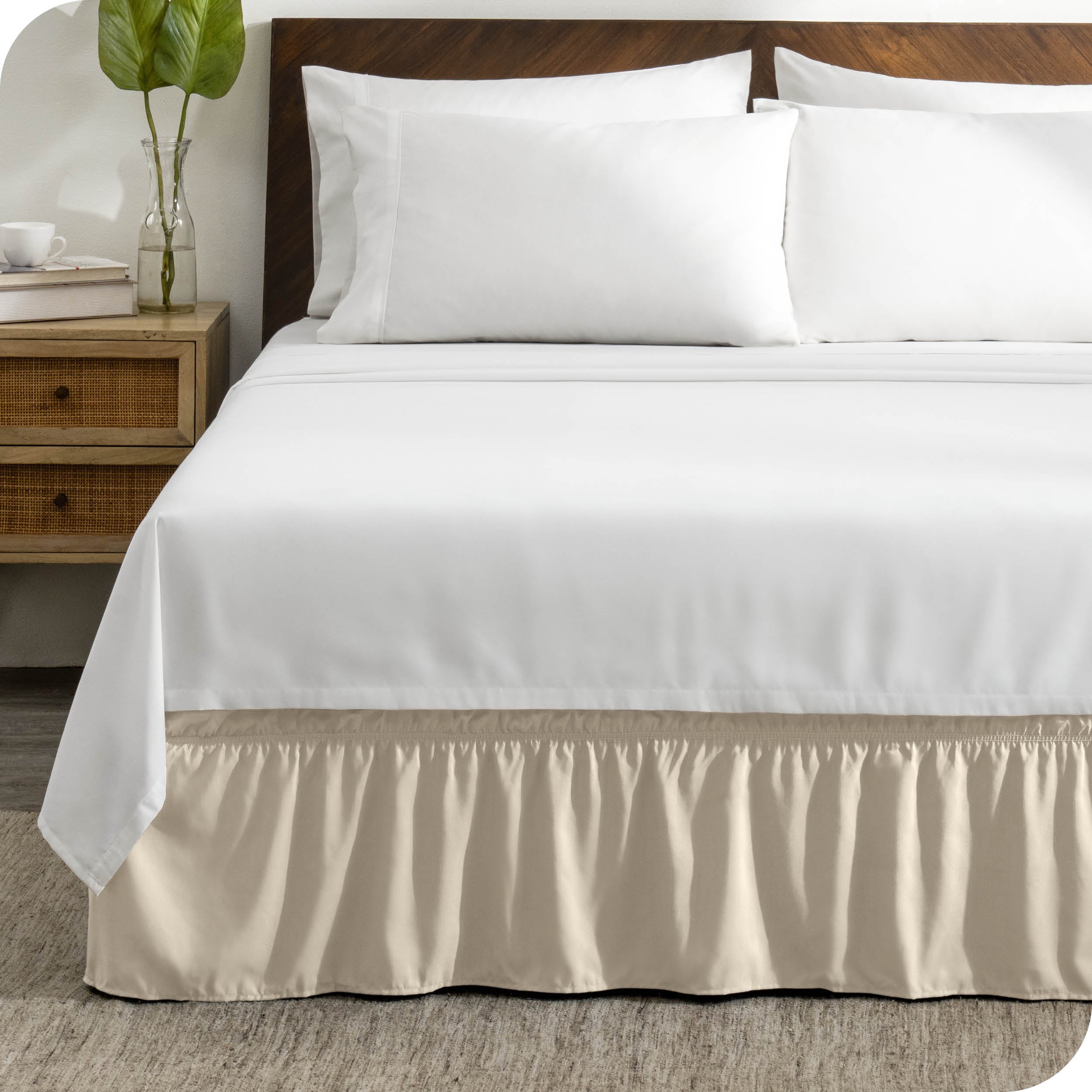 A wrap around bed skirt on a bed