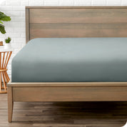End of bed view with fitted sheet made on the mattress of a modern bed. 