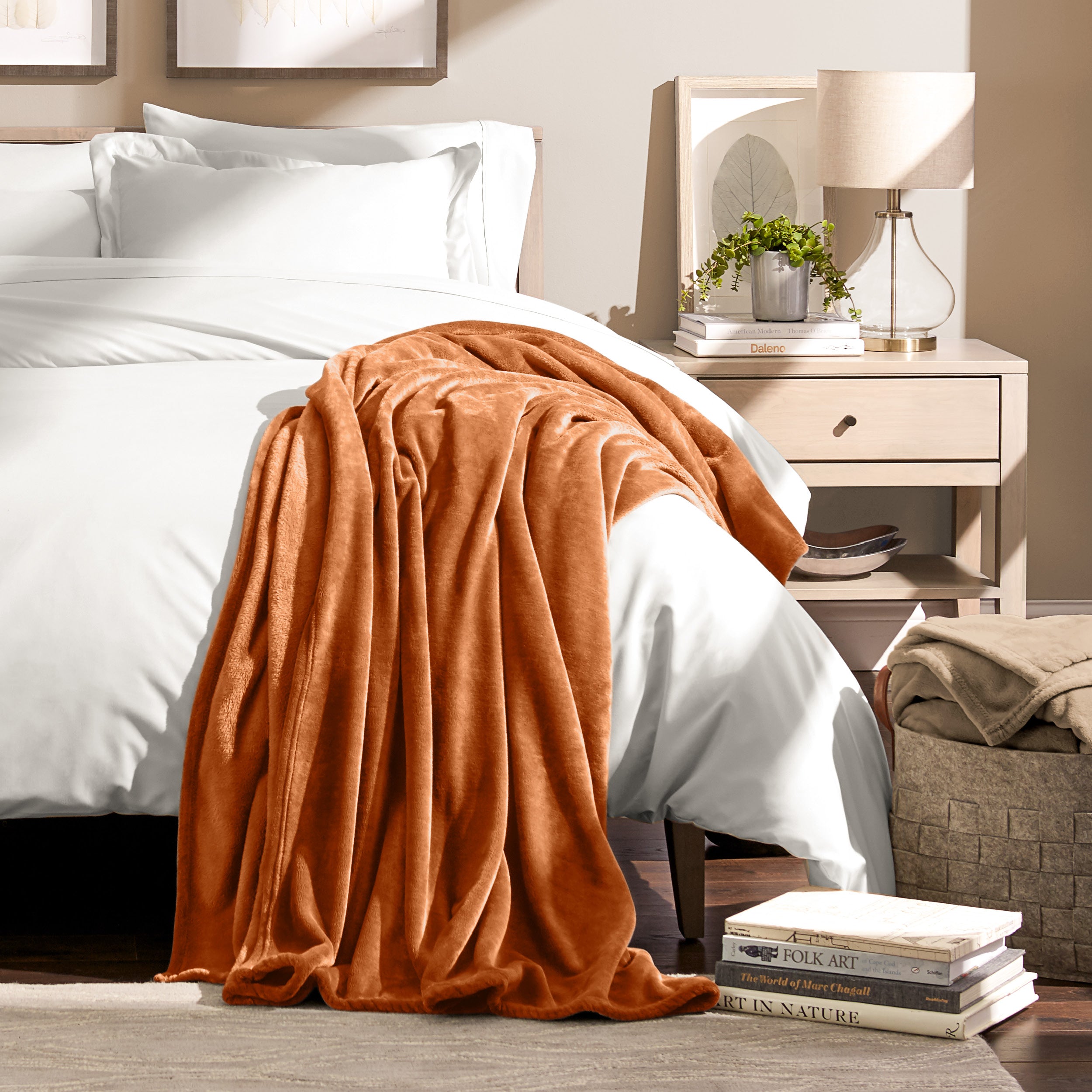 Microplush blanket laid out over a bed and folded back over itself
