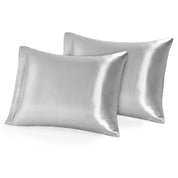Two silk pillowcases on pillows