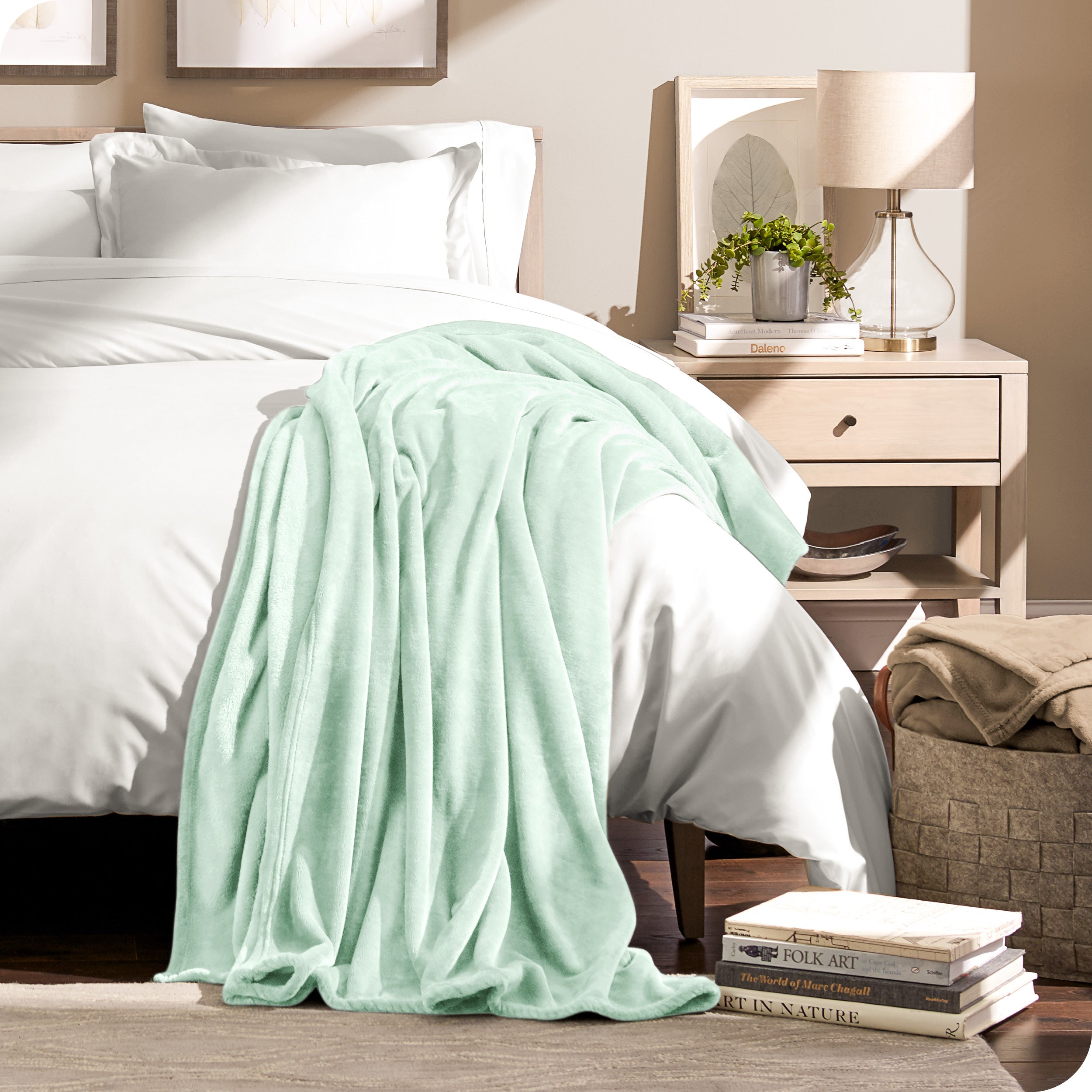 Microplush blanket laid out over a bed and folded back over itself