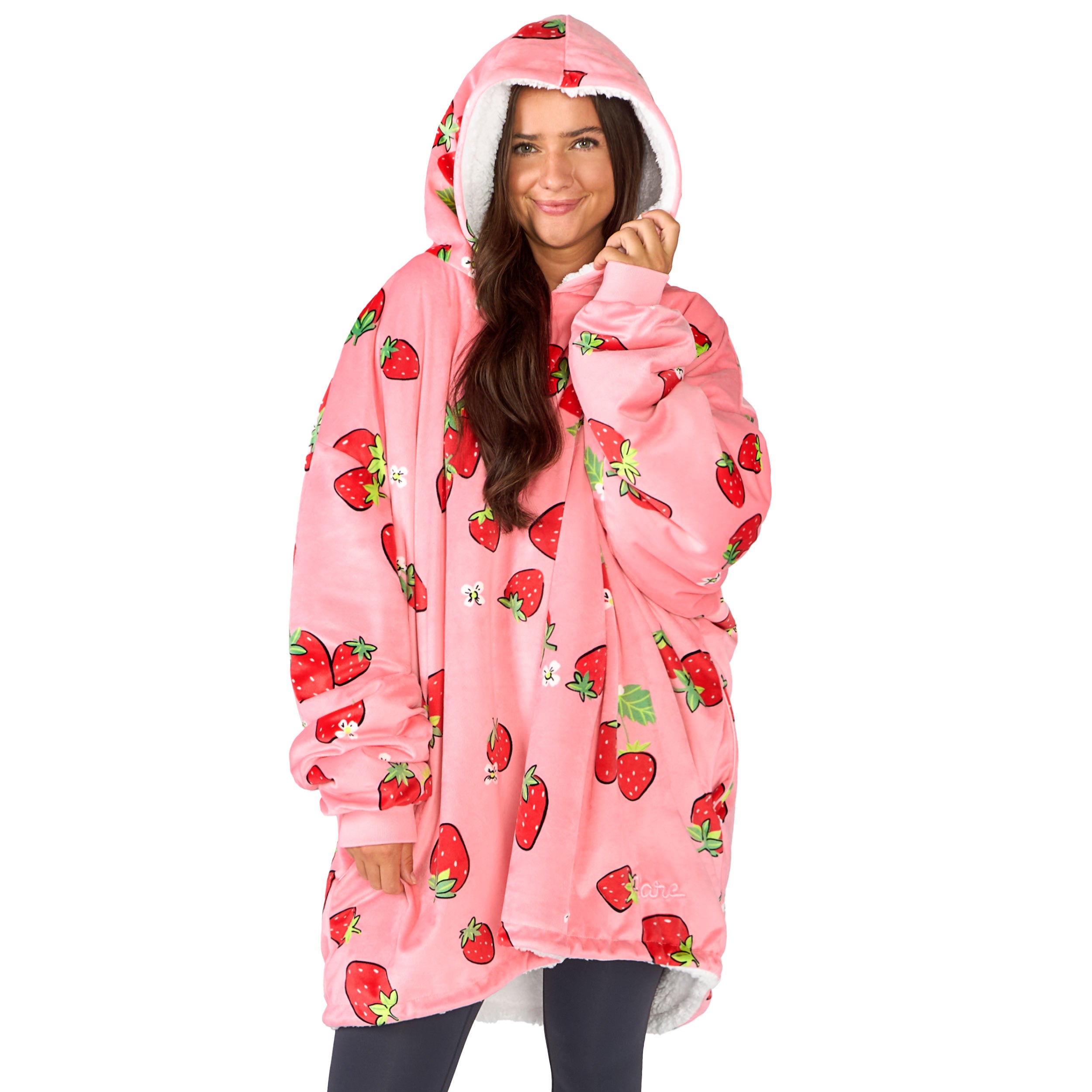 An adult with a sherpa wearable blanket on