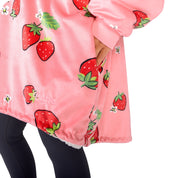 An adult with a hooded wearable blanket on