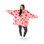 An adult with a hooded wearable blanket on