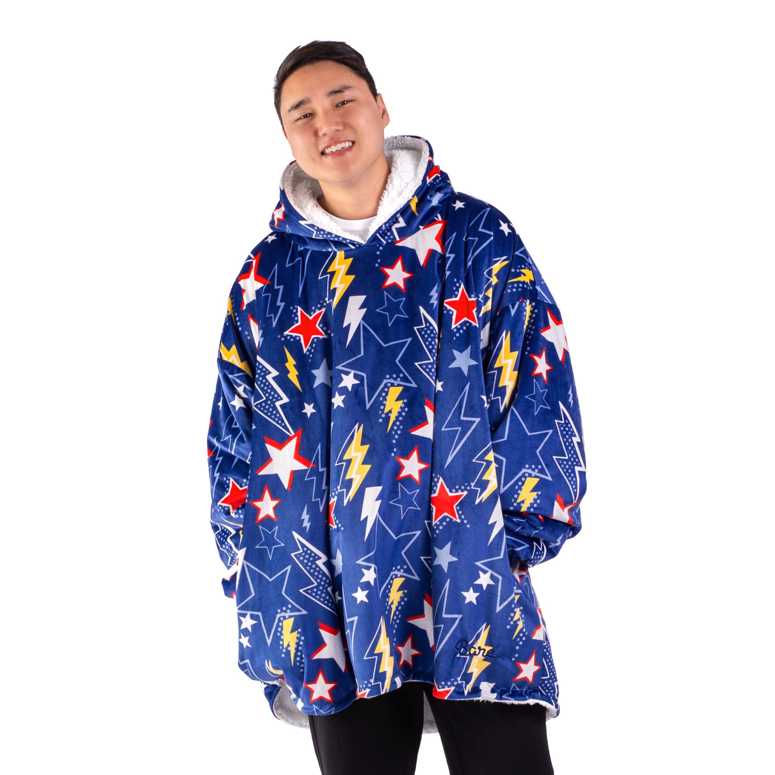 An adult with a sherpa wearable blanket on