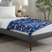A weighted blanket laid out on a bed
