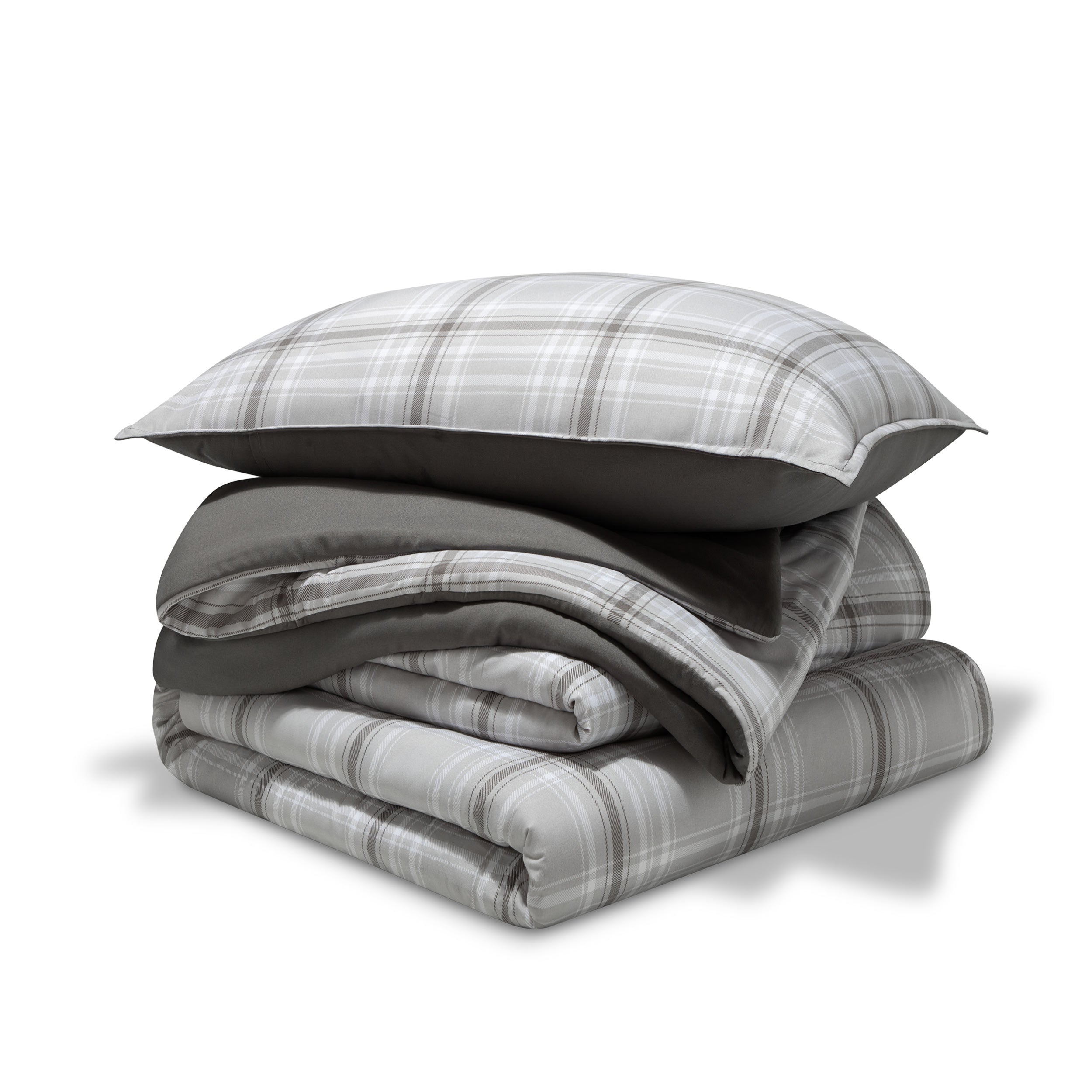 A comforter folded with a matching pillow sham stacked on top