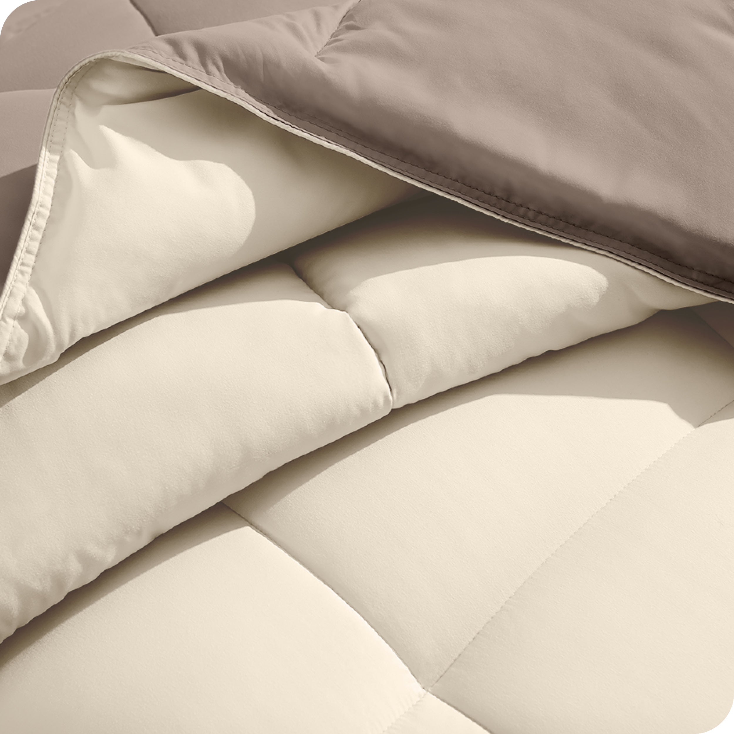 Close up of the comforter folded back showing the two different colored sides.