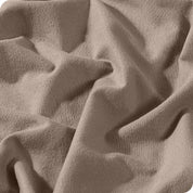A close view of a button and lining on the flannel duvet cover.
