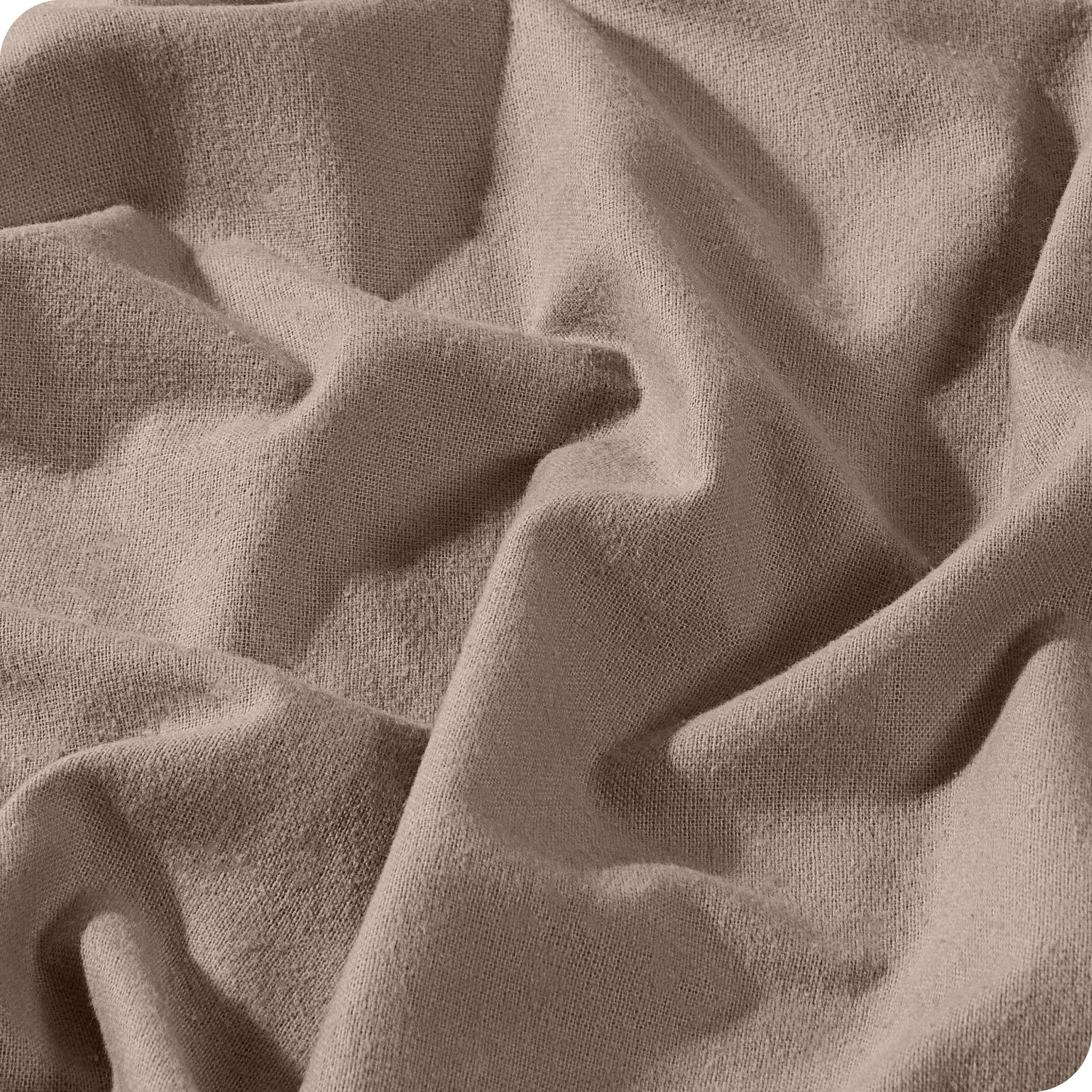 A close view of a button and lining on the flannel duvet cover.