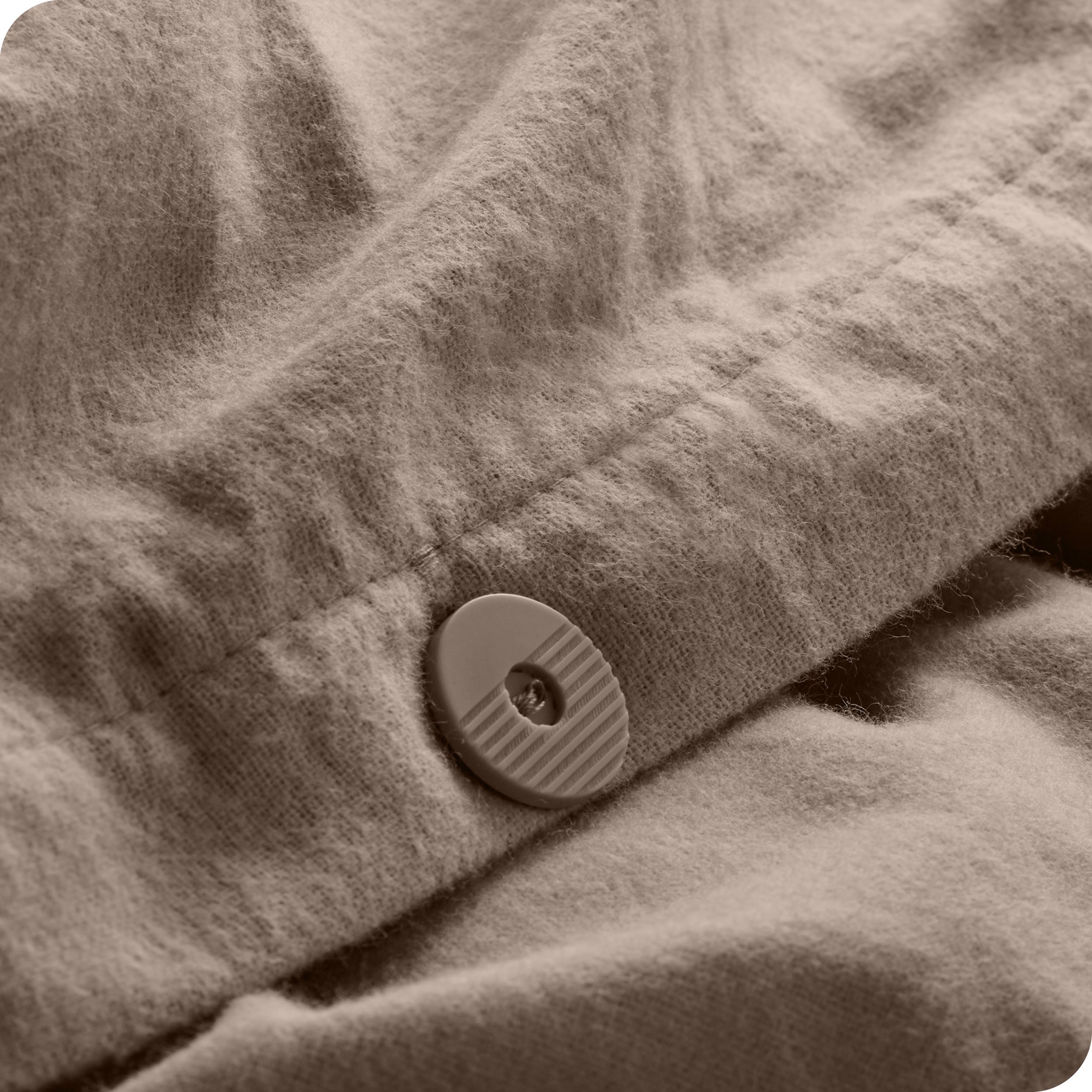 A close up of the tie corner of the duvet cover.