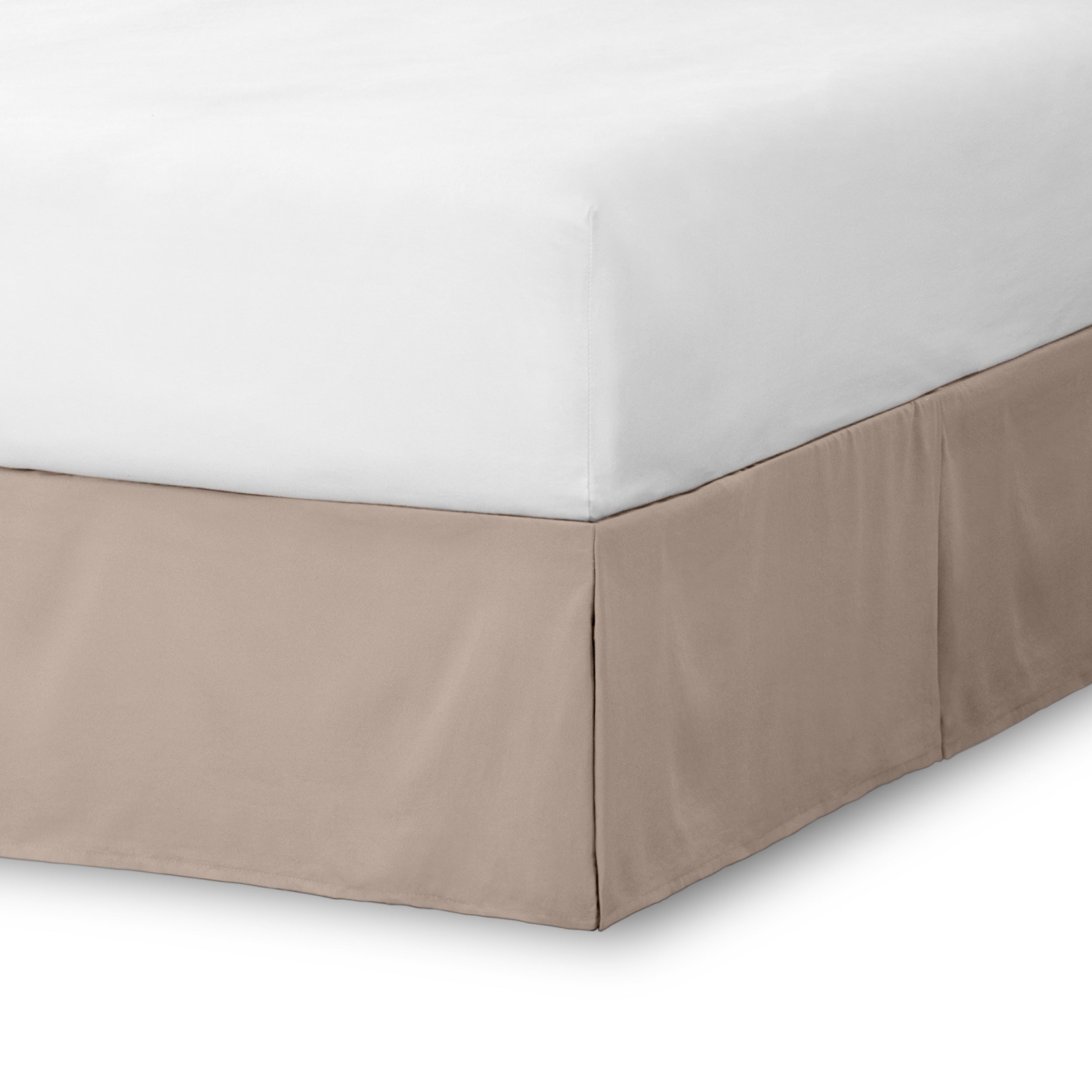 The corner of a bed skirt on a bed frame