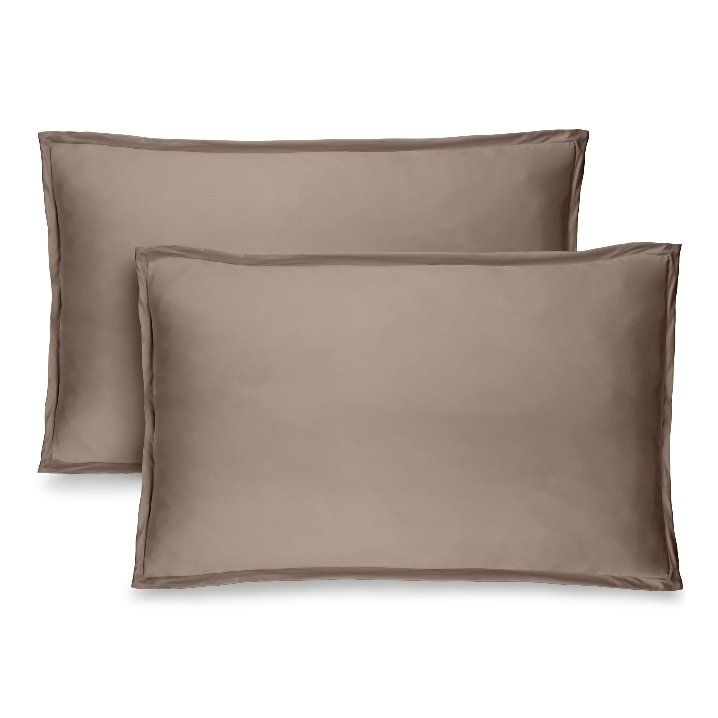 Two pillow shams on pillows standing up with one behind the other
