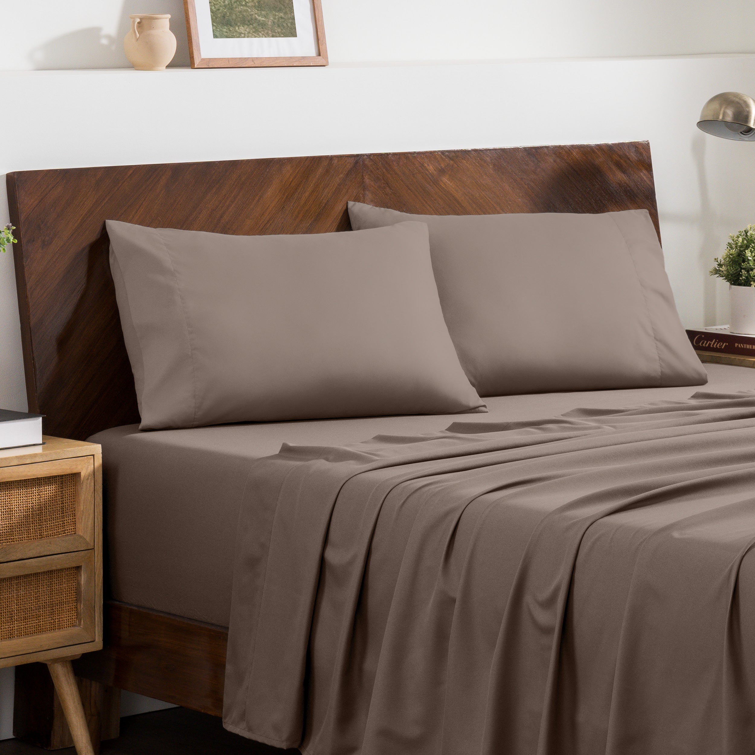 2 pillowcases on pillows on a nicely made bed