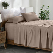 A cozy bedroom featuring a neatly made bed with soft, microfiber sheets