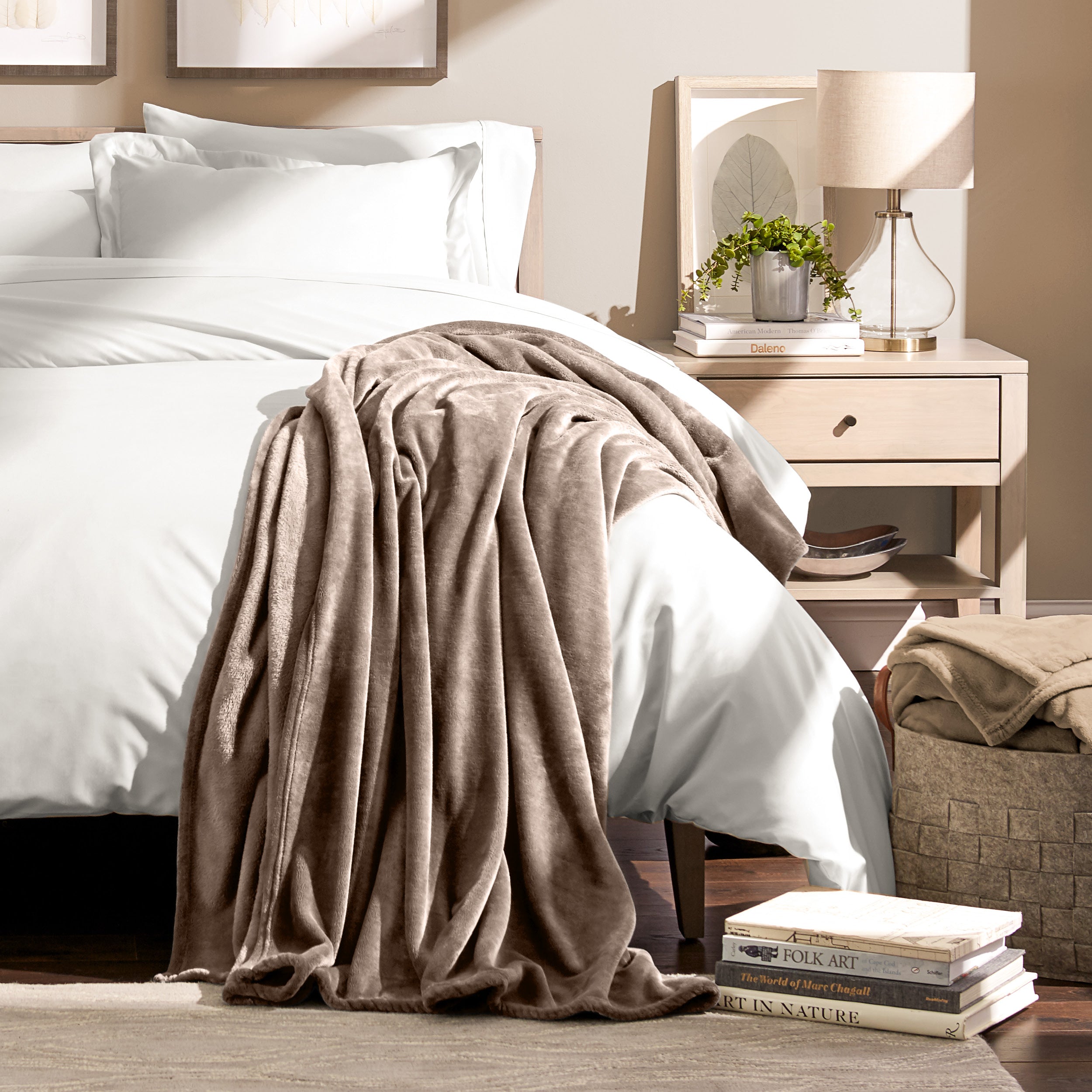 Microplush blanket laid out over a bed and folded back over itself