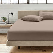 An organic cotton fitted sheet on a mattress
