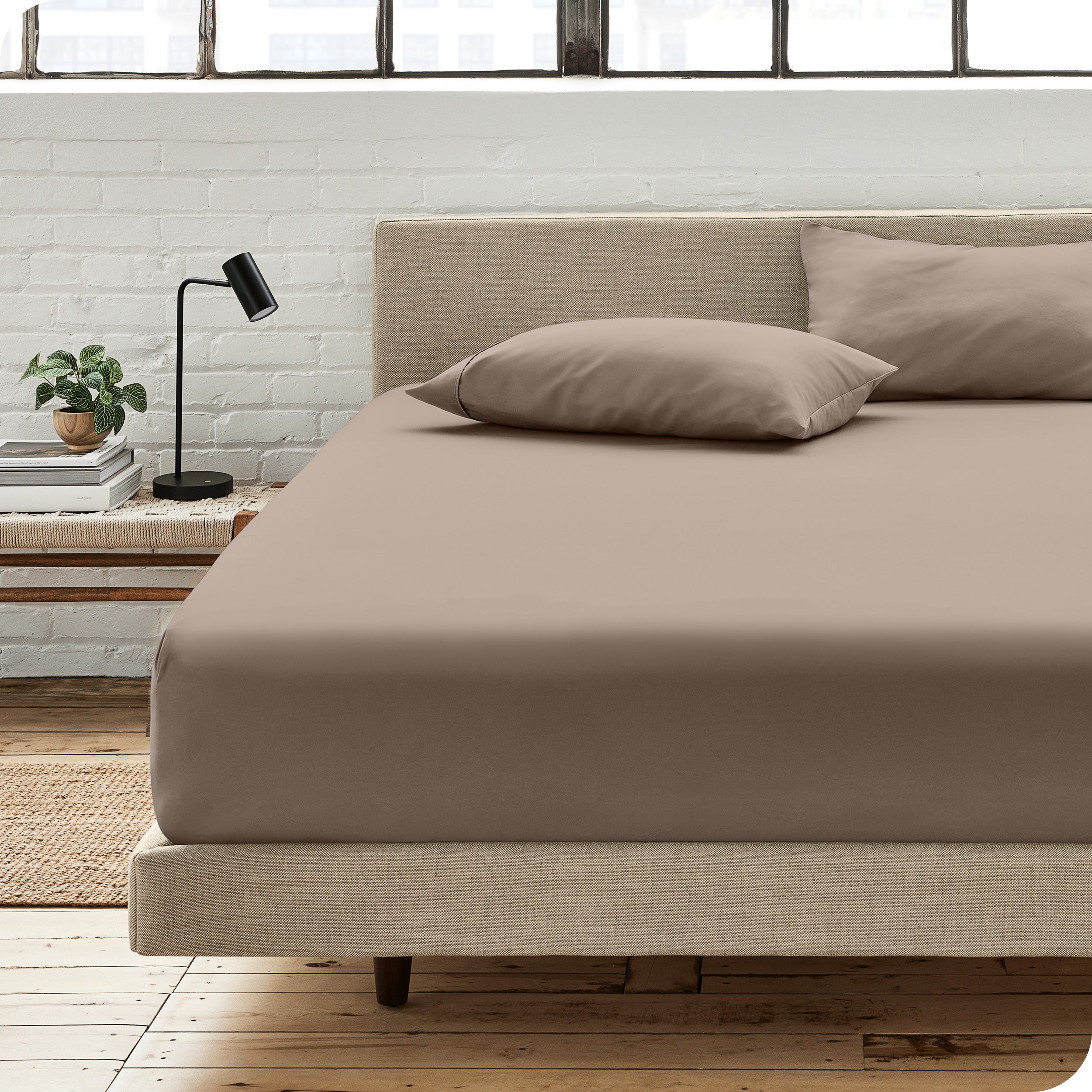 An organic cotton fitted sheet on a mattress