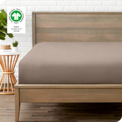 An organic percale bottom sheet on a mattress
