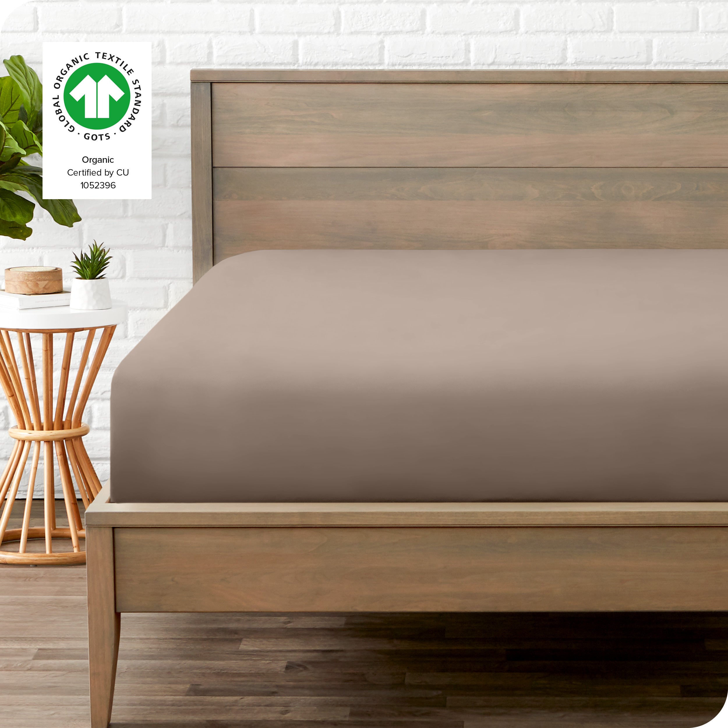 An organic percale bottom sheet on a mattress