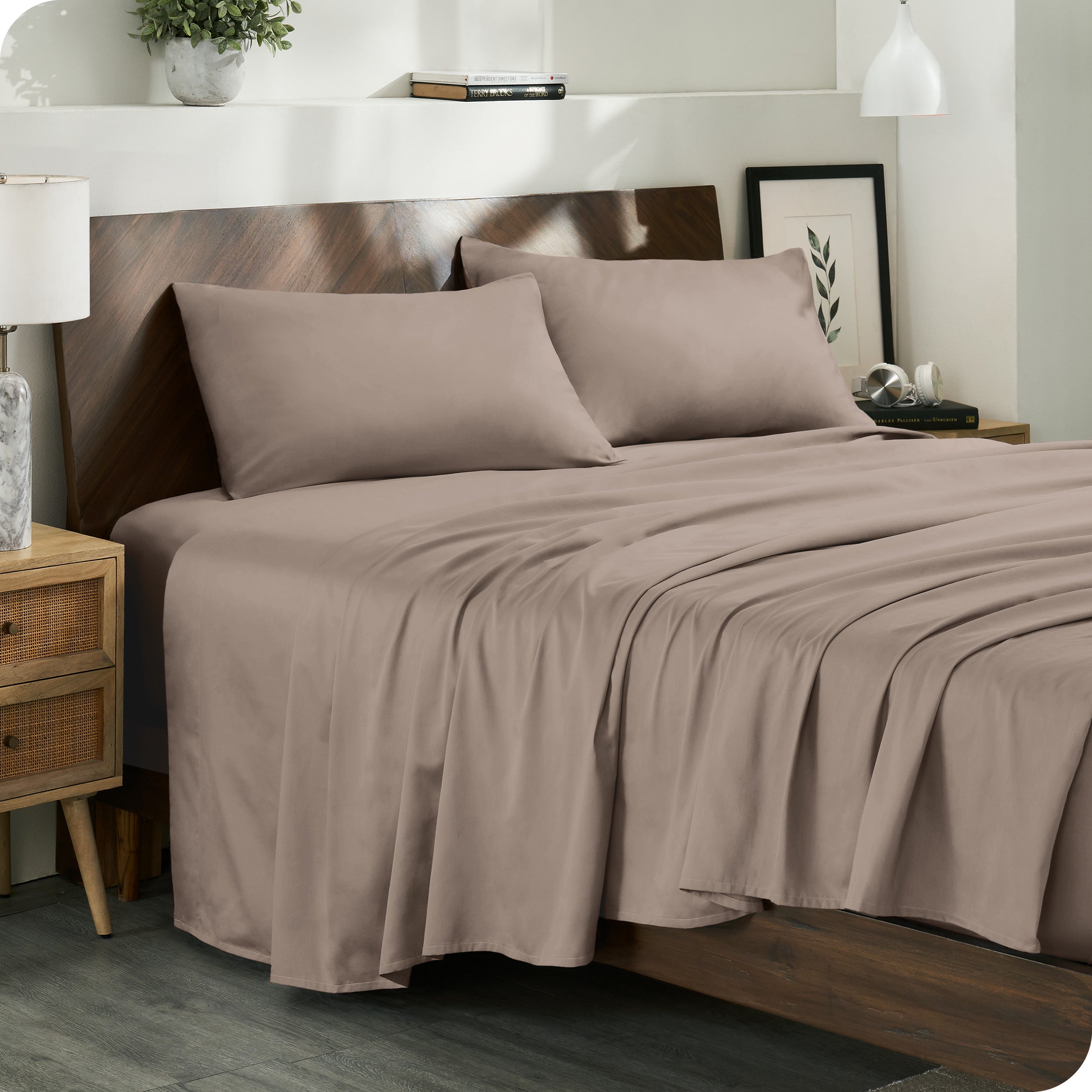 Diagonal view of a decorated room scene with sateen sheets