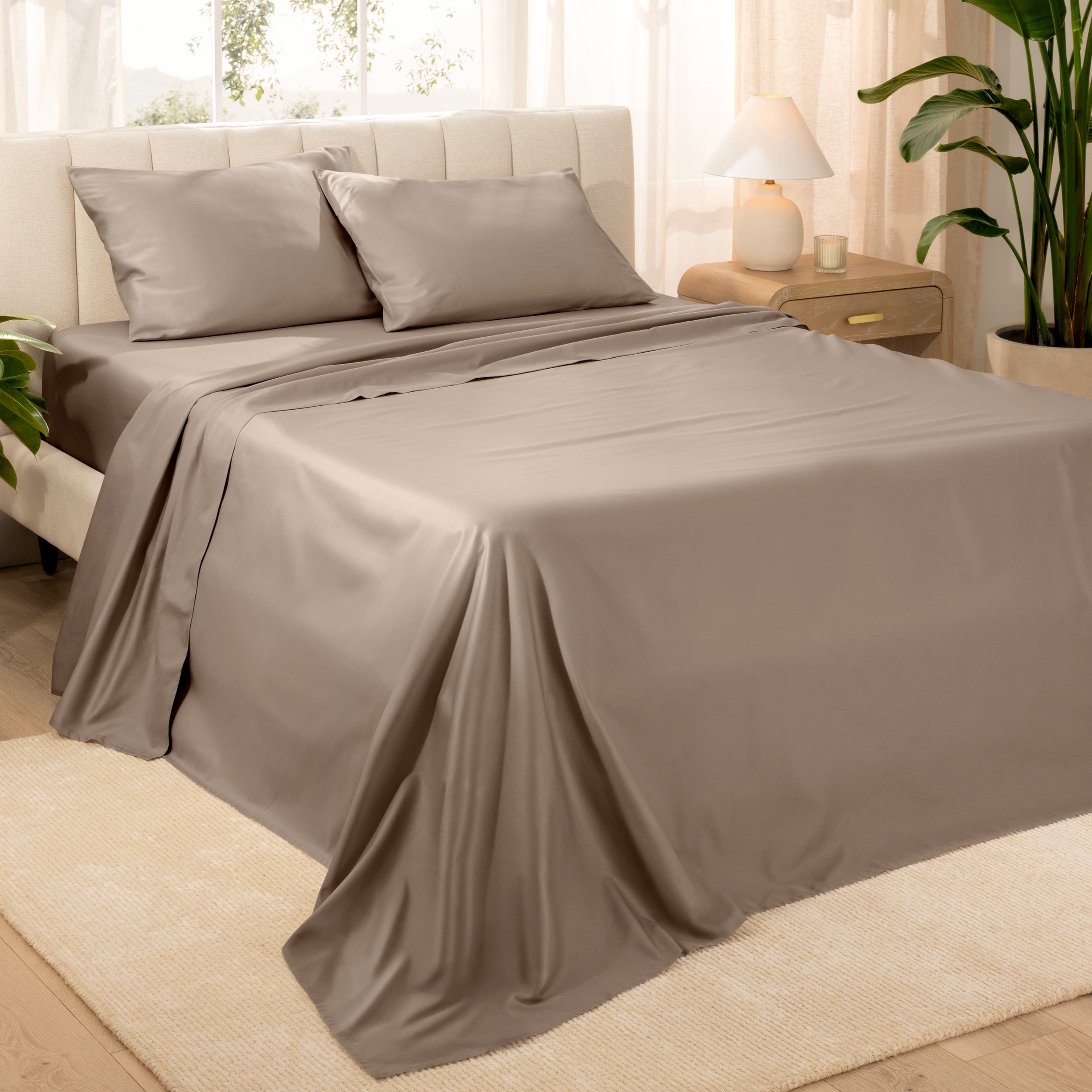 Diagonal view of a decorated room scene with sateen sheets