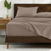 Percale sheets on bed in a modern bedroom