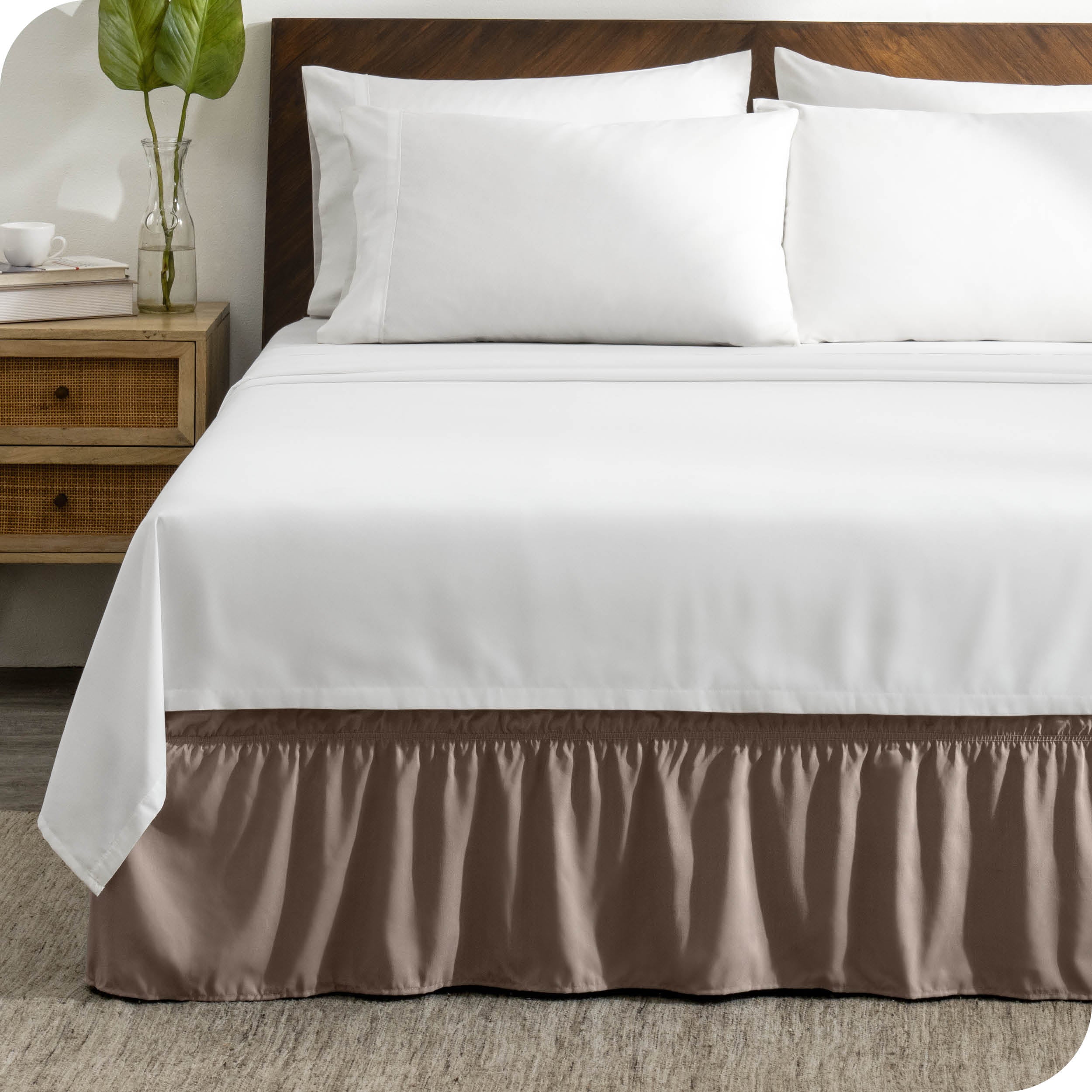 A wrap around bed skirt on a bed