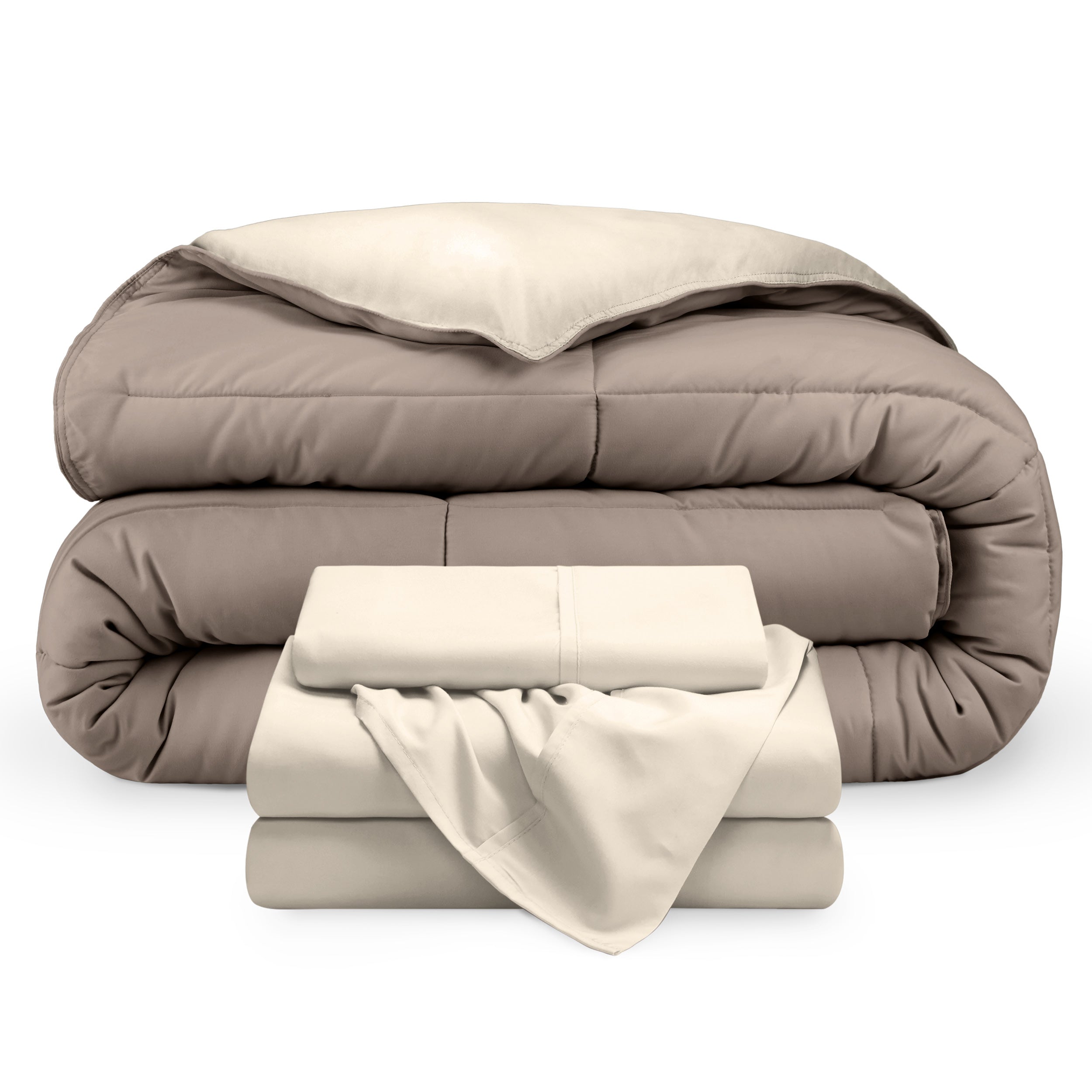 A reversible microfiber comforter and a coordinating sheet set folded and stacked 