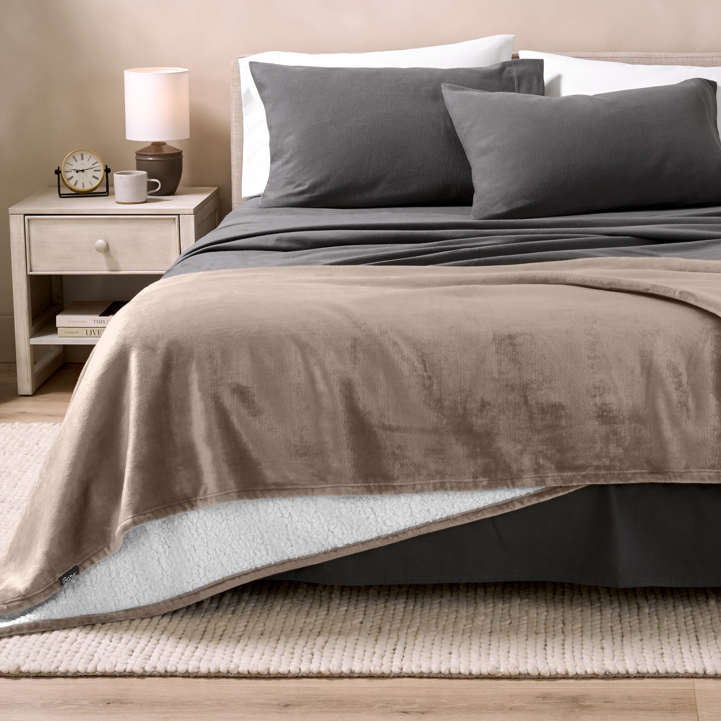 Sherpa Blanket laying on a bed folded over itself part way